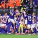 Japan celebrate their late equaliser against the Netherlands in a World Cup Group F match.