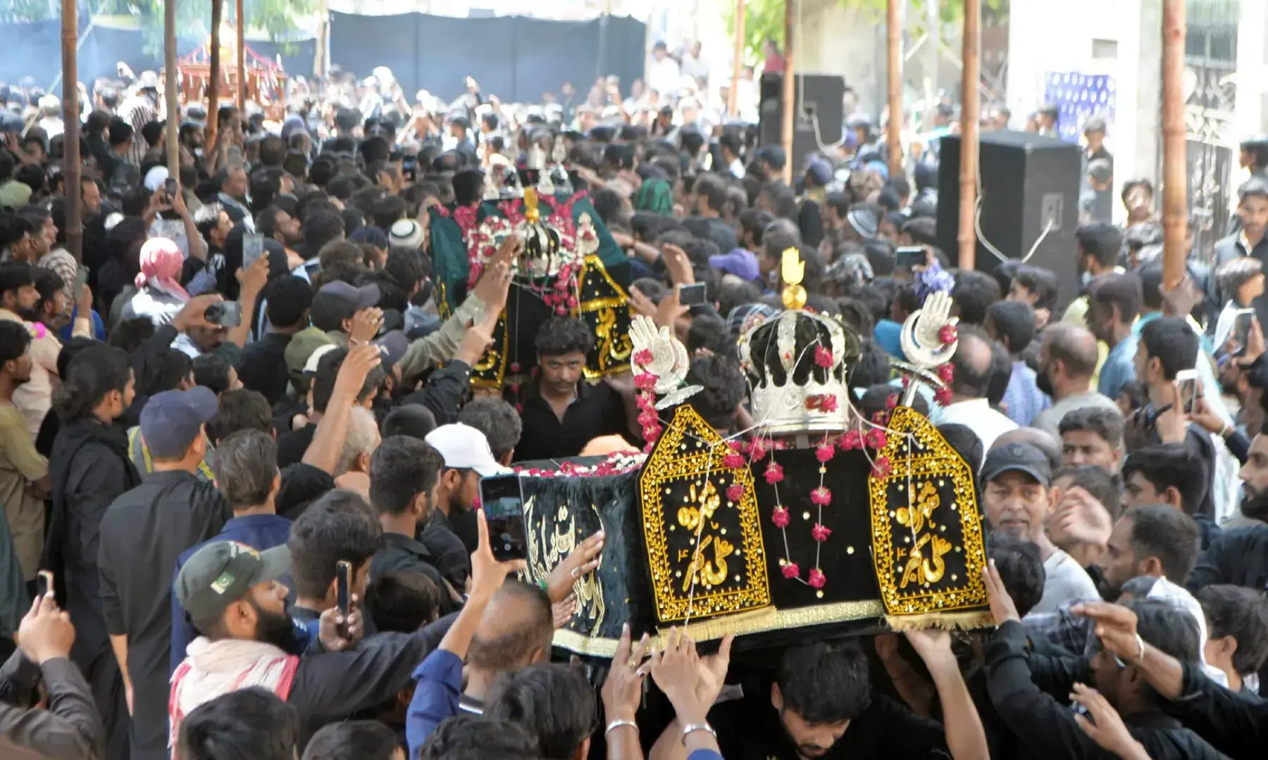 Youm-e-Ashura mourning procession with security personnel deployed along the route in Pakistan