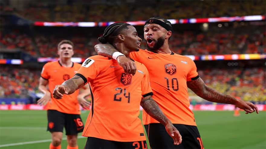 Netherlands players celebrating a goal against Sweden during a World Cup Group F match.