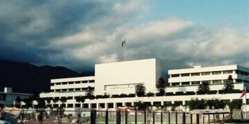 Pakistani lawmakers voting in National Assembly during approval of federal budget allocations.