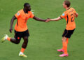 Netherlands football team celebrating a goal during their 3-1 FIFA World Cup victory over Tunisia
