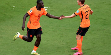 Netherlands football team celebrating a goal during their 3-1 FIFA World Cup victory over Tunisia