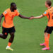 Netherlands football team celebrating a goal during their 3-1 FIFA World Cup victory over Tunisia
