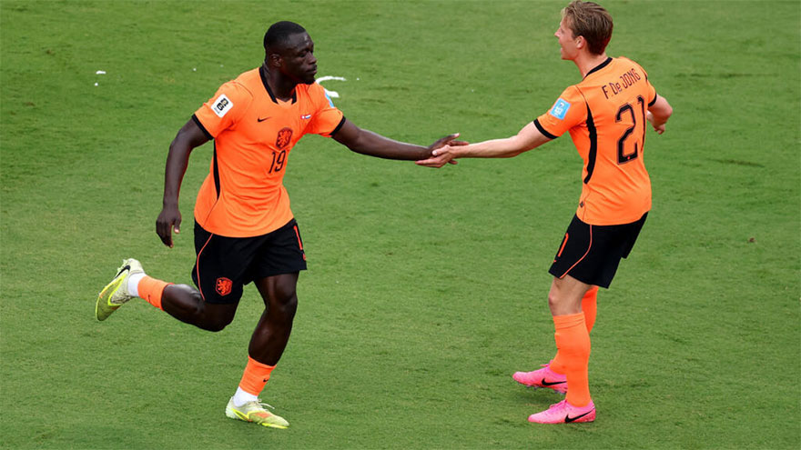 Netherlands football team celebrating a goal during their 3-1 FIFA World Cup victory over Tunisia
