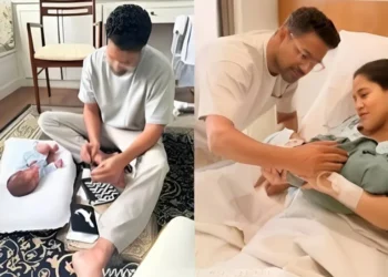 Ali Gul Pir holding newborn baby in hospital celebrating birth of son and becoming a father