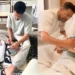 Ali Gul Pir holding newborn baby in hospital celebrating birth of son and becoming a father