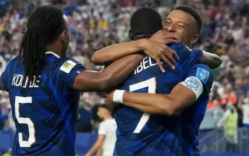 Kylian Mbappe celebrating a goal for France during a World Cup match delayed by storm at Lincoln Financial Field