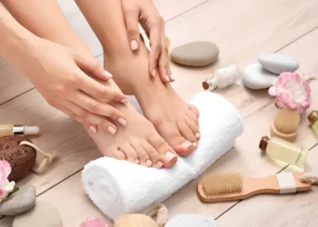 A nail technician using sterilised tools during a professional manicure to help prevent bacterial and fungal infections