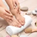 A nail technician using sterilised tools during a professional manicure to help prevent bacterial and fungal infections