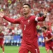 Cristiano Ronaldo celebrating a goal for Portugal in a FIFA World Cup match against Uzbekistan