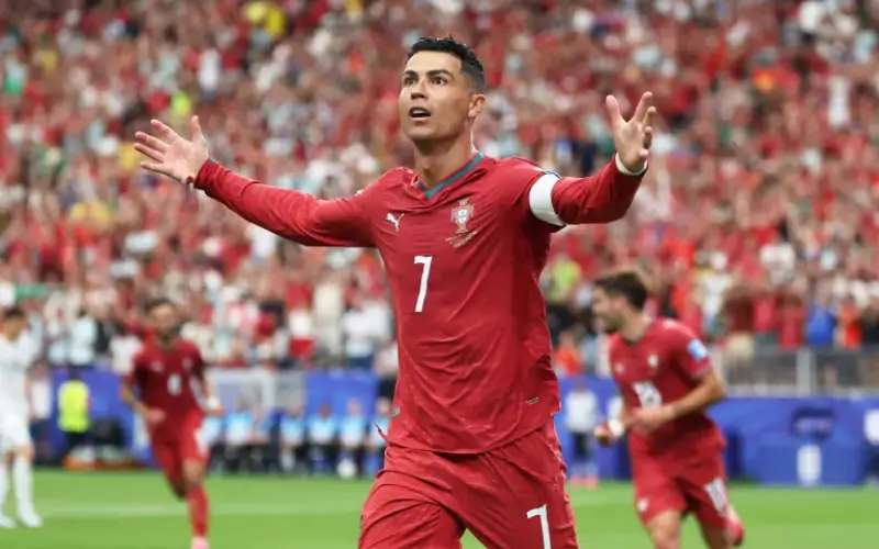 Cristiano Ronaldo celebrating a goal for Portugal in a FIFA World Cup match against Uzbekistan