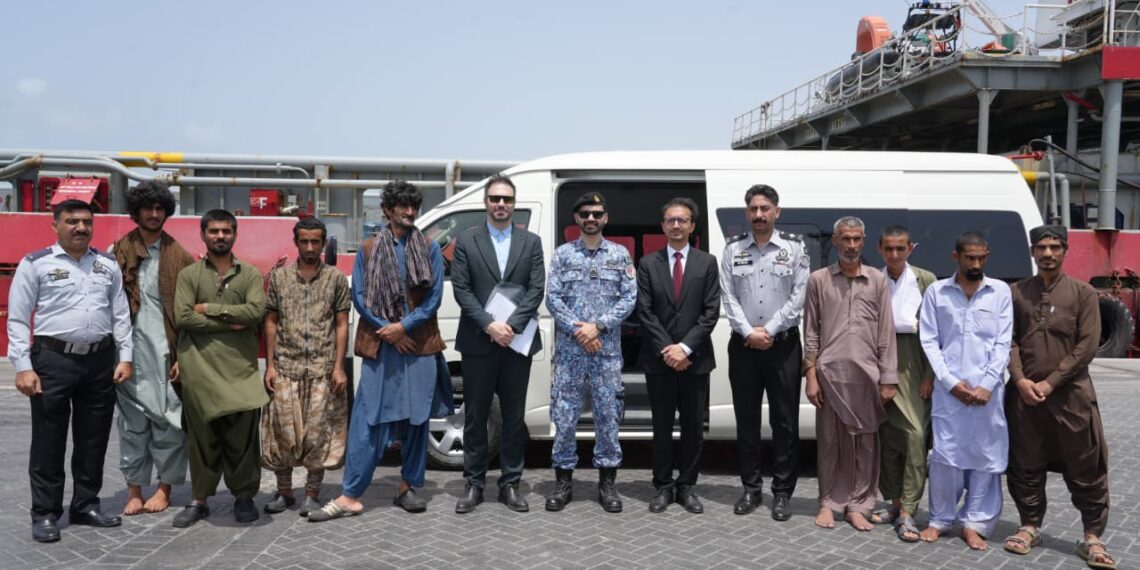 Pakistan Maritime Security Agency staff assisting rescued Iranian nationals during repatriation process in Karachi.