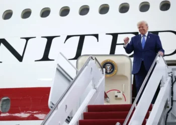 US President Donald Trump stands beside the Qatar-donated Boeing 747 designated as a temporary Air Force One aircraft.