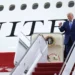 US President Donald Trump stands beside the Qatar-donated Boeing 747 designated as a temporary Air Force One aircraft.