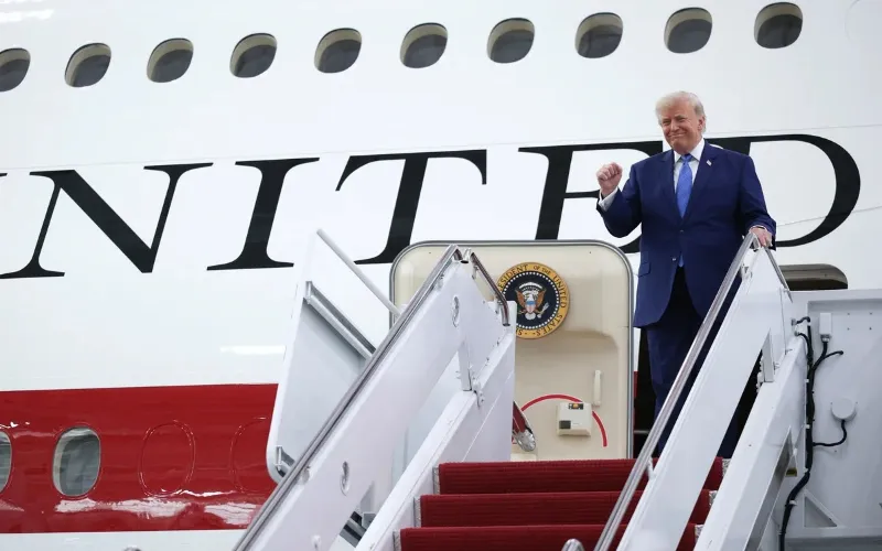 US President Donald Trump stands beside the Qatar-donated Boeing 747 designated as a temporary Air Force One aircraft.