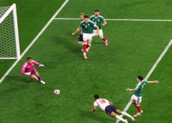 Jude Bellingham celebrates during England's 3-2 World Cup victory against Mexico at the Azteca Stadium.