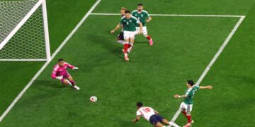 Jude Bellingham celebrates during England's 3-2 World Cup victory against Mexico at the Azteca Stadium.