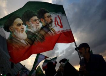 Iran's Supreme Leader Mojtaba Khamenei delivers a message during funeral ceremonies for Ayatollah Ali Khamenei.