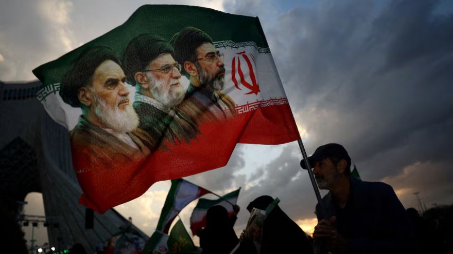 Iran's Supreme Leader Mojtaba Khamenei delivers a message during funeral ceremonies for Ayatollah Ali Khamenei.