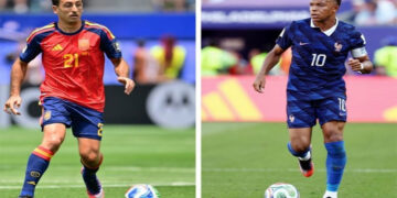 France and Spain players competing for a place in the FIFA World Cup final.
