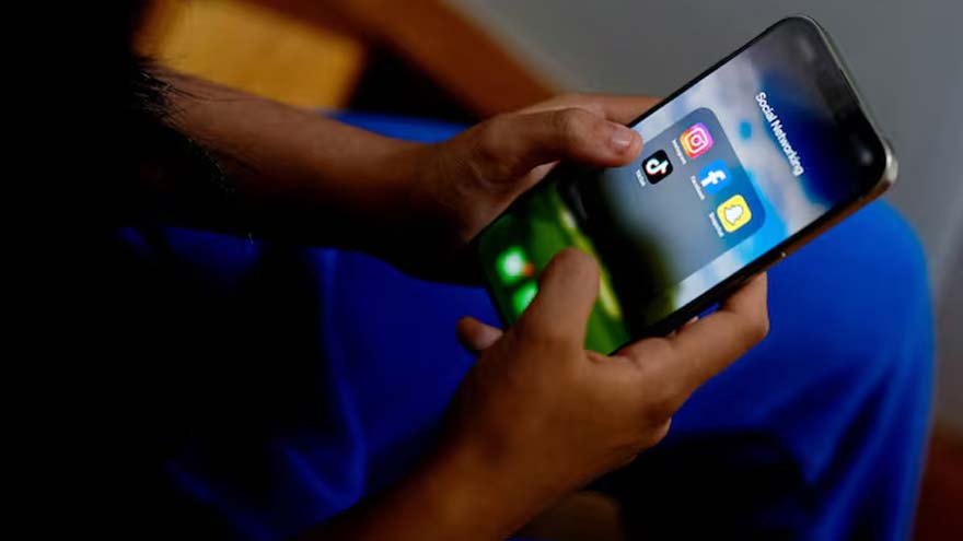 A smartphone displaying social media apps alongside Australia's online safety regulations.