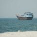 Commercial ships sailing through the Strait of Hormuz following attacks that killed an Indian seafarer and injured several crew members.