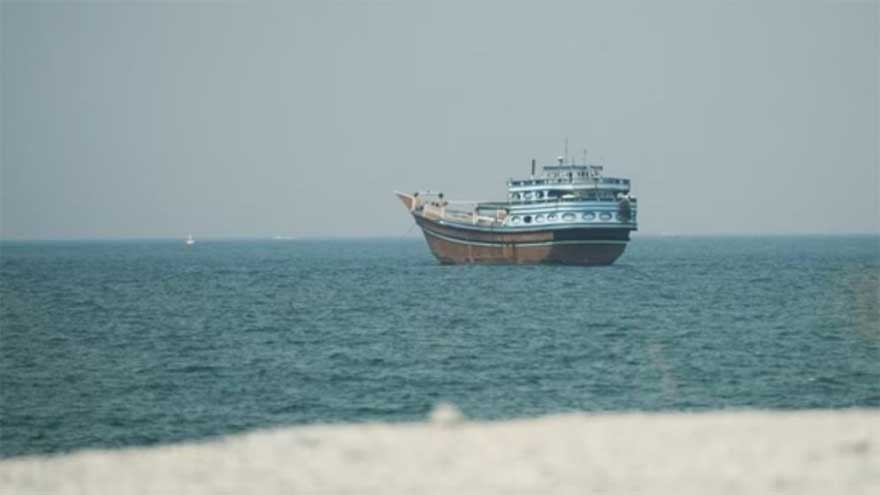 Commercial ships sailing through the Strait of Hormuz following attacks that killed an Indian seafarer and injured several crew members.