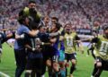 Argentina players celebrate victory over England after reaching the World Cup final with a dramatic 2-1 comeback.