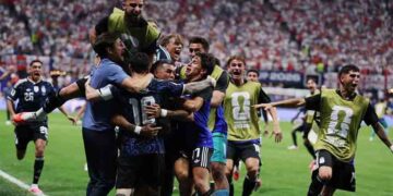 Argentina players celebrate victory over England after reaching the World Cup final with a dramatic 2-1 comeback.