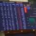 Electronic trading board at the Pakistan Stock Exchange showing gains in the KSE-100 Index during Thursday's session.
