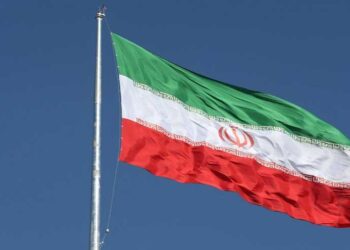 Iranian and British flags displayed as diplomatic tensions rise over the UK's IRGC designation.