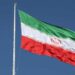 Iranian and British flags displayed as diplomatic tensions rise over the UK's IRGC designation.