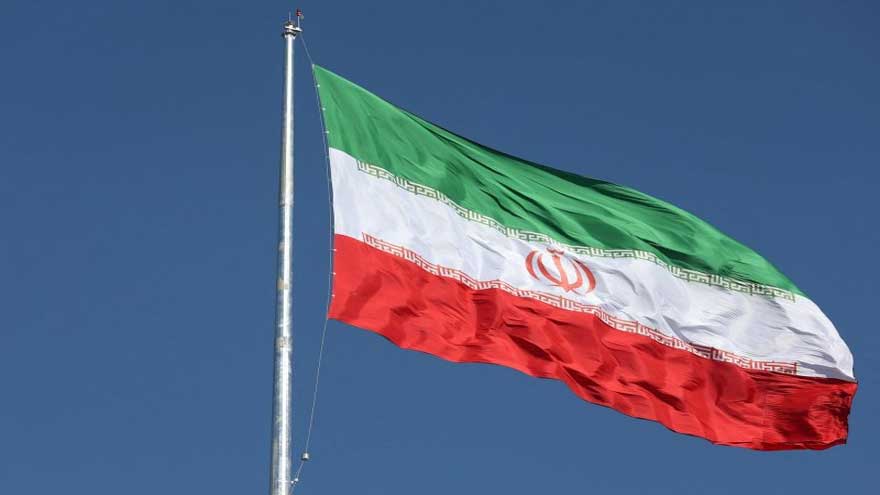 Iranian and British flags displayed as diplomatic tensions rise over the UK's IRGC designation.