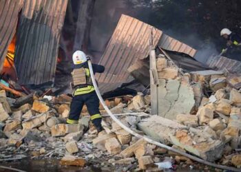 Emergency crews respond after Russian attacks hit Ukraine's Black Sea port infrastructure in Odesa and Mykolaiv.