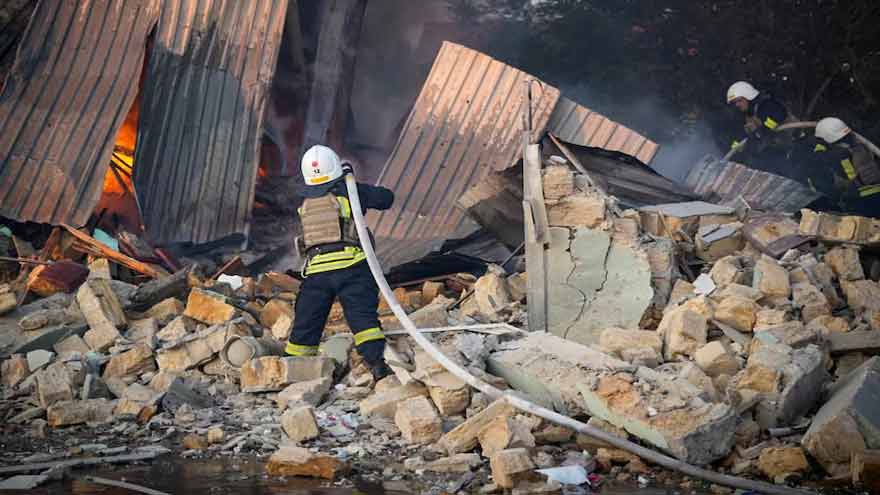 Emergency crews respond after Russian attacks hit Ukraine's Black Sea port infrastructure in Odesa and Mykolaiv.