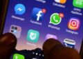 Facebook and Instagram logos displayed on a smartphone during a reported Meta service outage.