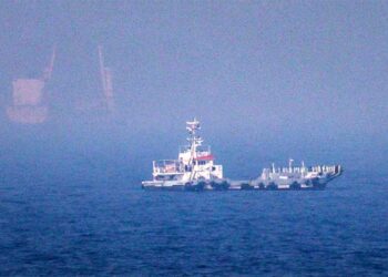 Commercial tanker navigating the Strait of Hormuz during escalating conflict between Iran and the United States.