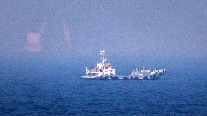 Commercial tanker navigating the Strait of Hormuz during escalating conflict between Iran and the United States.
