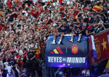 Spain's national football team celebrates its World Cup victory aboard an open-top bus in Madrid.