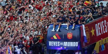 Spain's national football team celebrates its World Cup victory aboard an open-top bus in Madrid.