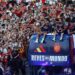 Spain's national football team celebrates its World Cup victory aboard an open-top bus in Madrid.