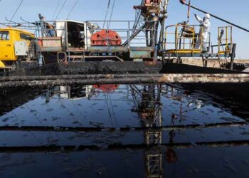 Oil barrels representing Brent crude and WTI prices amid Middle East geopolitical tensions.