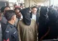 Karachi police officers secure an area during an SIU operation related to the Dr Akash murder case.