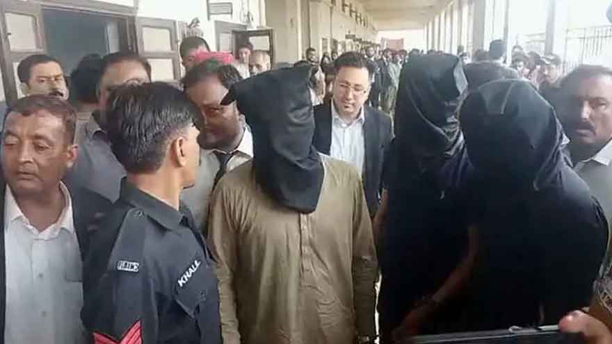 Karachi police officers secure an area during an SIU operation related to the Dr Akash murder case.