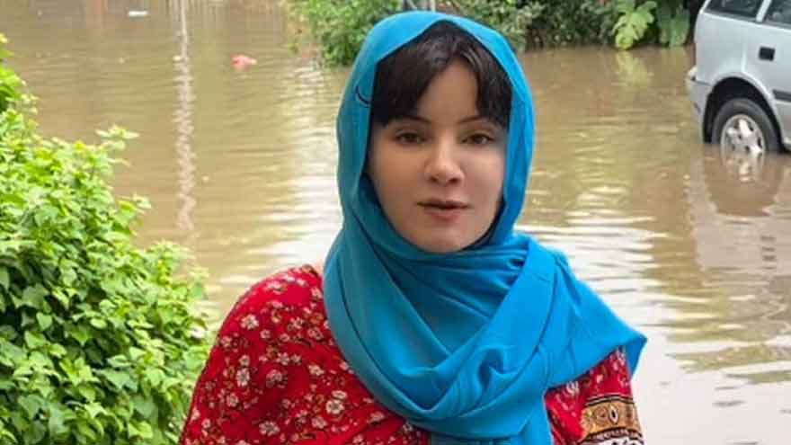 Rabi Pirzada records a video showing rainwater accumulation in Lahore's DHA.