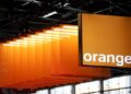 Orange logo displayed with modern data centre infrastructure representing the planned AI and cloud computing expansion in France.