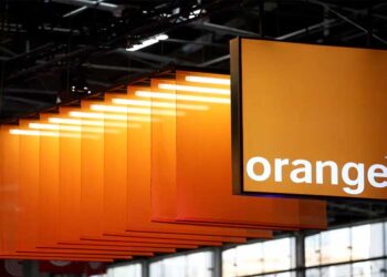 Orange logo displayed with modern data centre infrastructure representing the planned AI and cloud computing expansion in France.