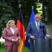 German Chancellor Friedrich Merz speaks during a political event as his government faces criticism over a cabinet reshuffle.