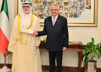 Pakistan Deputy Prime Minister Ishaq Dar shakes hands with Kuwaiti Foreign Minister Sheikh Jarrah Jaber Al-Ahmad Al-Sabah during talks in Islamabad.
