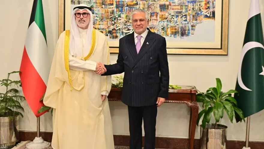 Pakistan Deputy Prime Minister Ishaq Dar shakes hands with Kuwaiti Foreign Minister Sheikh Jarrah Jaber Al-Ahmad Al-Sabah during talks in Islamabad.